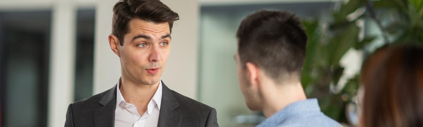 Two people chatting at a reception