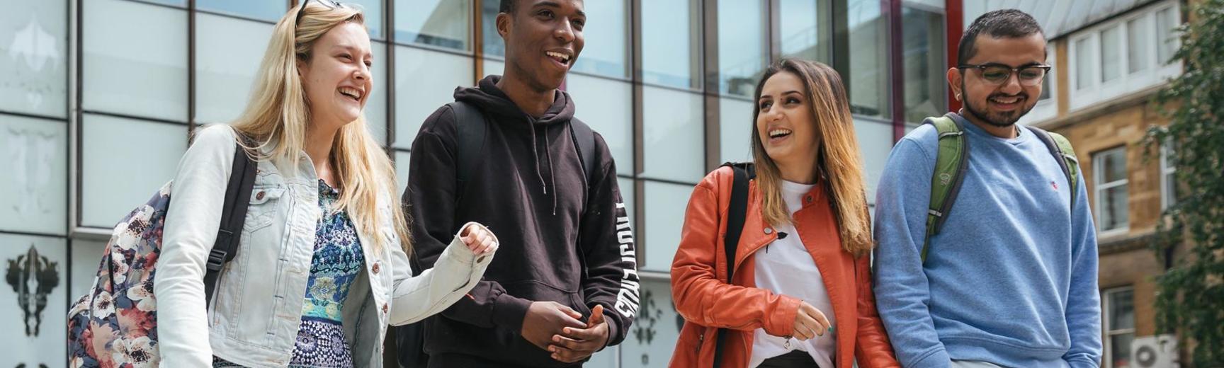 Students chat outside the Said Building