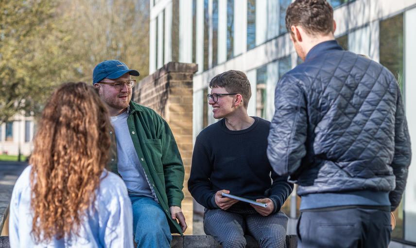 students talk outside