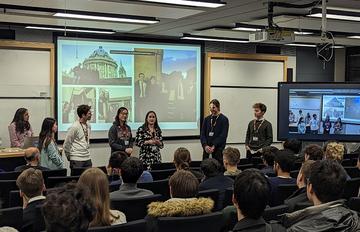 mphil students presenting to an audience